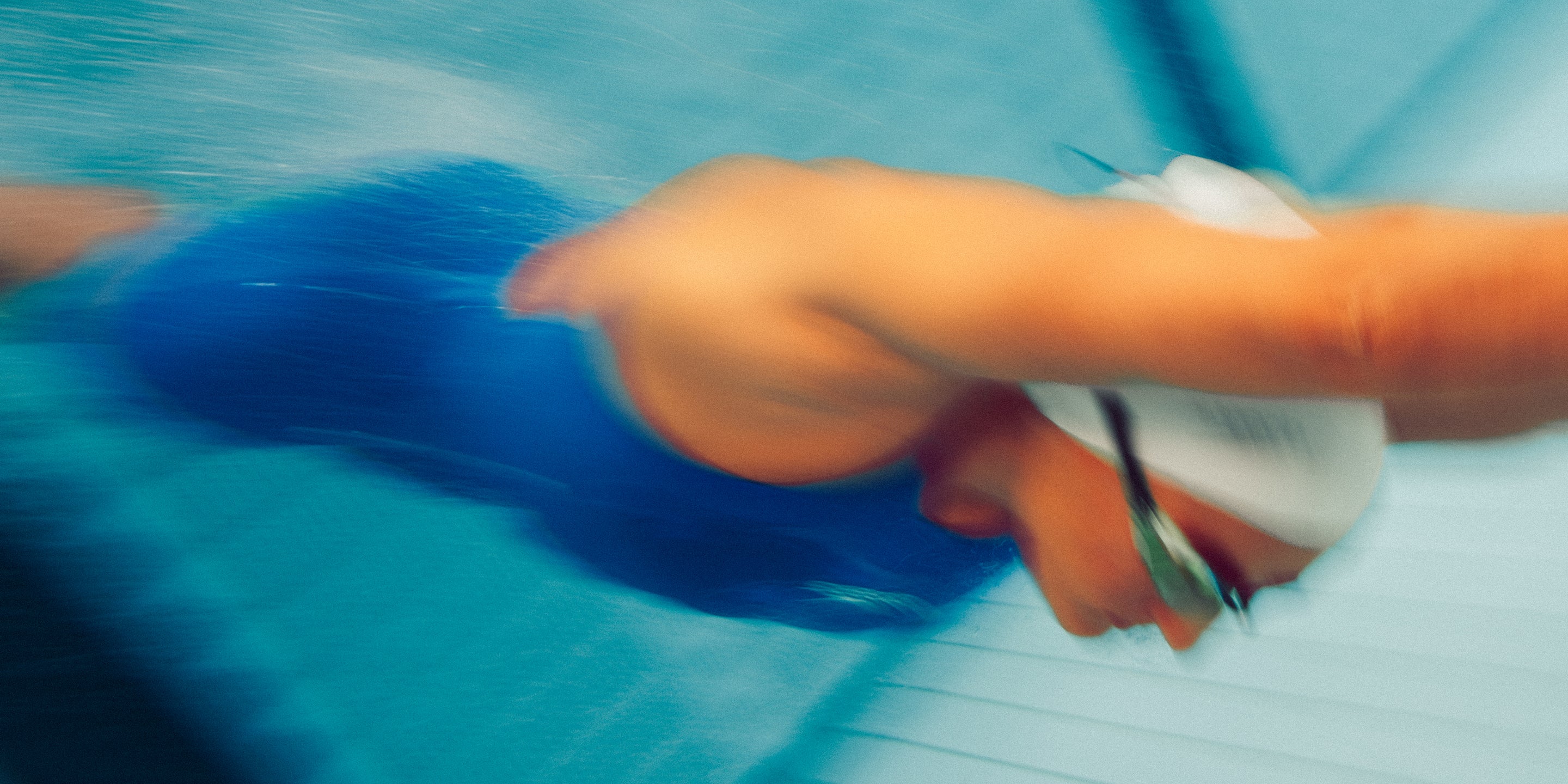 Close-up of a woman wearing the blue Speedo Fastskin full-body racing suit.